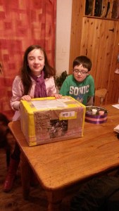 Elva and Eamonn with the box from Darragh in America